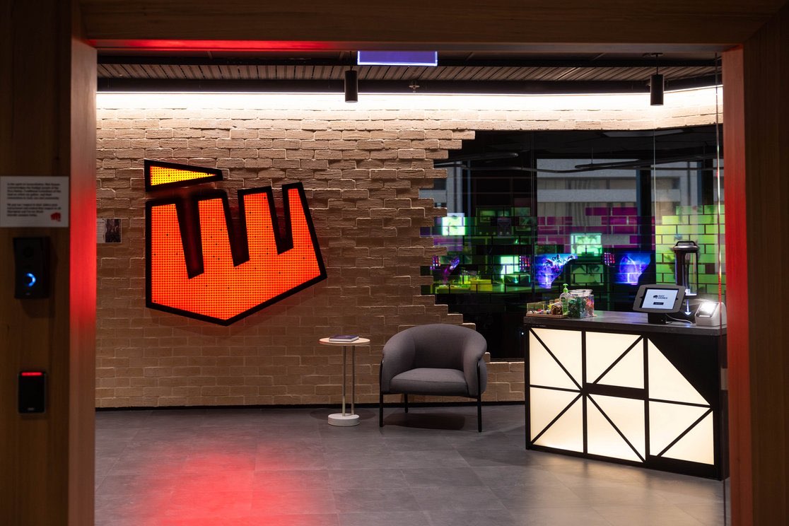 Riot Games Sydney office entry with illuminated logo