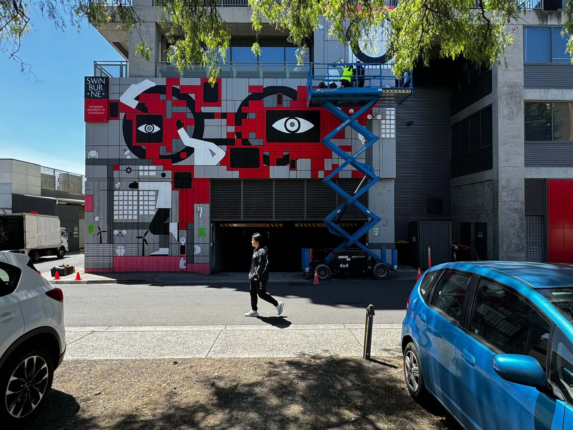 Swinburne mural, passer-by