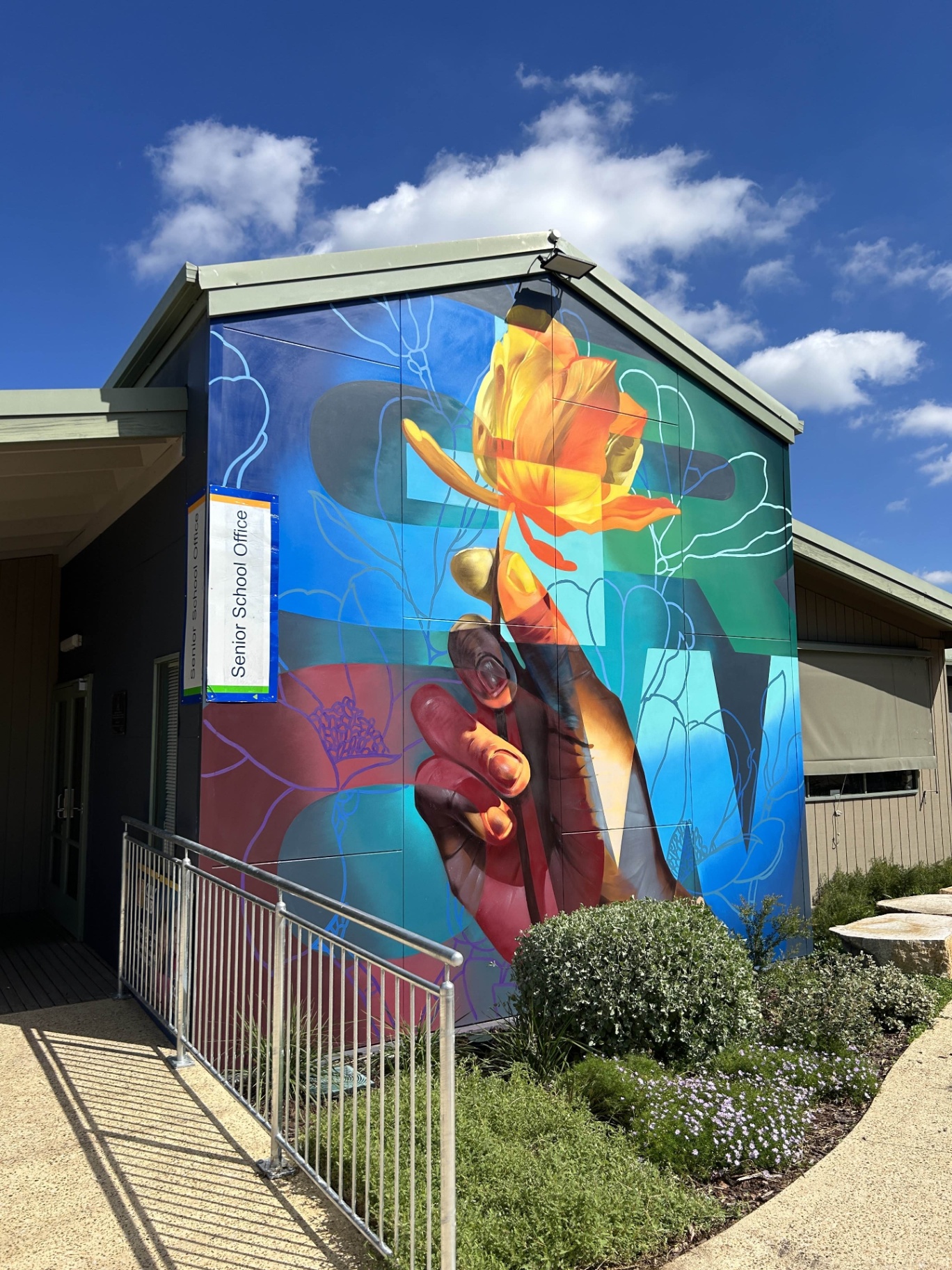 Front elevation of the finished GROW mural in sunlight