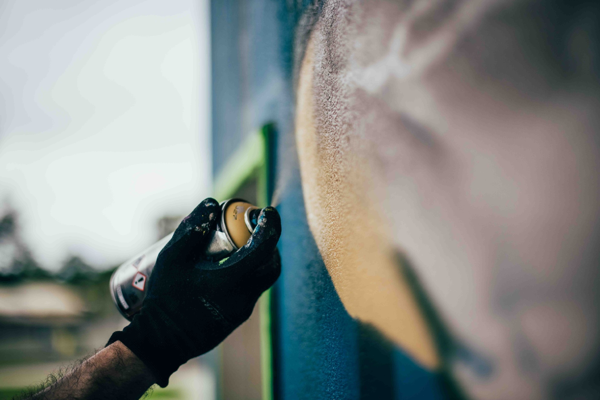 Spray can detail during mural production