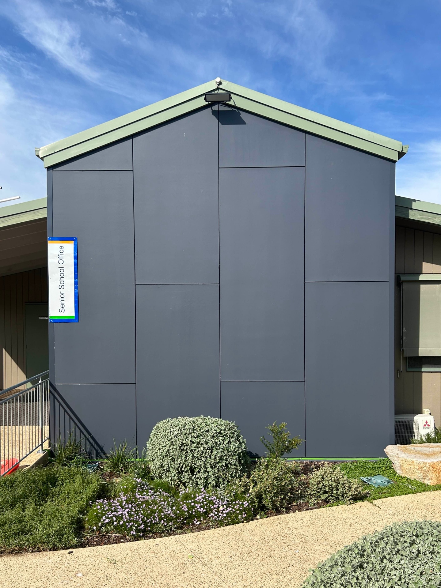 Blank Senior School Office wall before the GROW mural
