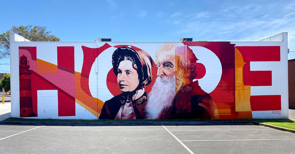 Completed HOPE mural full wide view with portraits and letterforms
