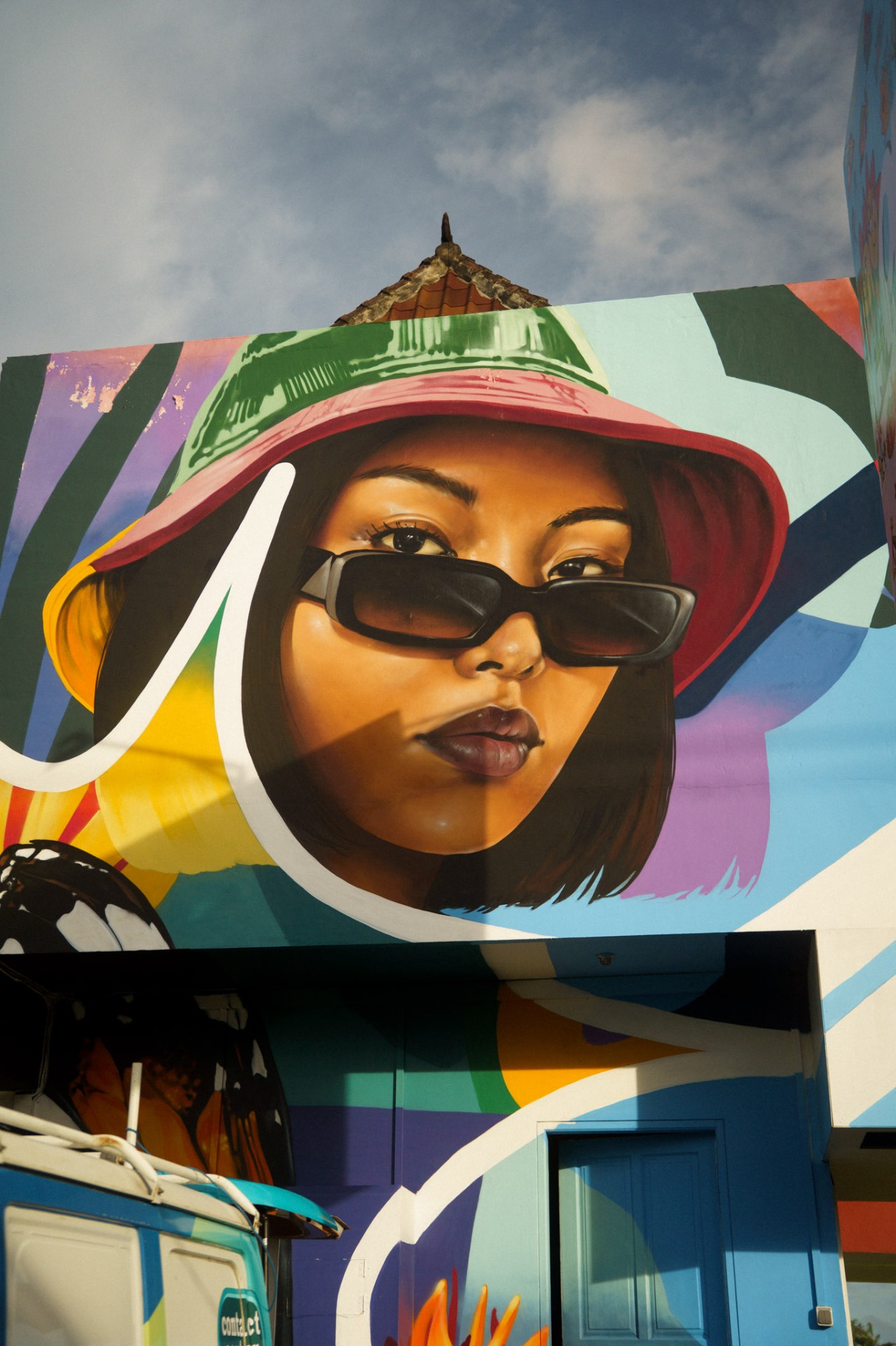 Close-up portrait detail of Open House Bali mural