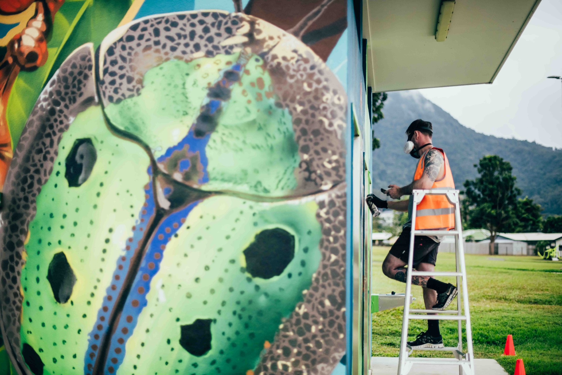 Close-up detail of the beetle motif during painting