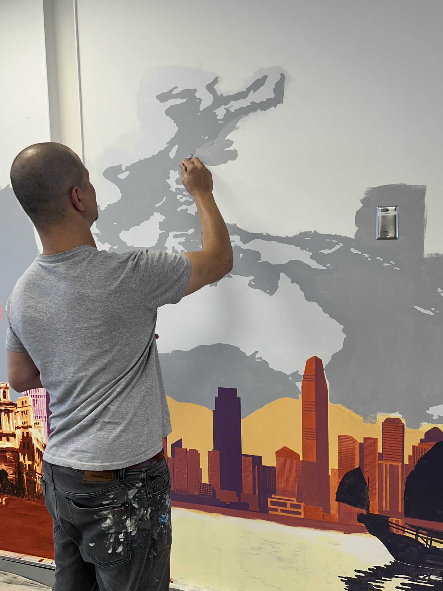Artist working on Hong Kong skyline detail