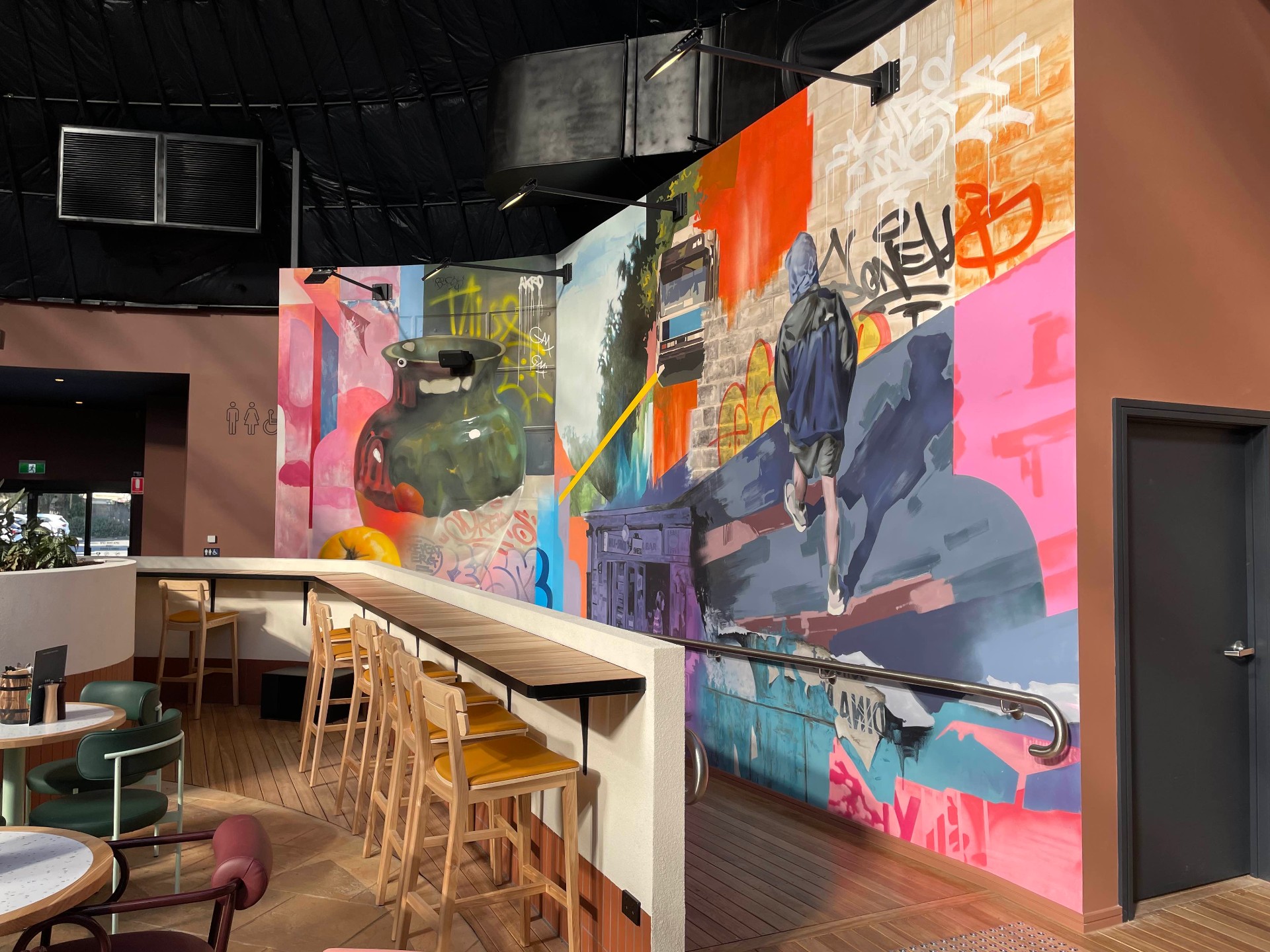 Moreland Hotel bar area with vase mural